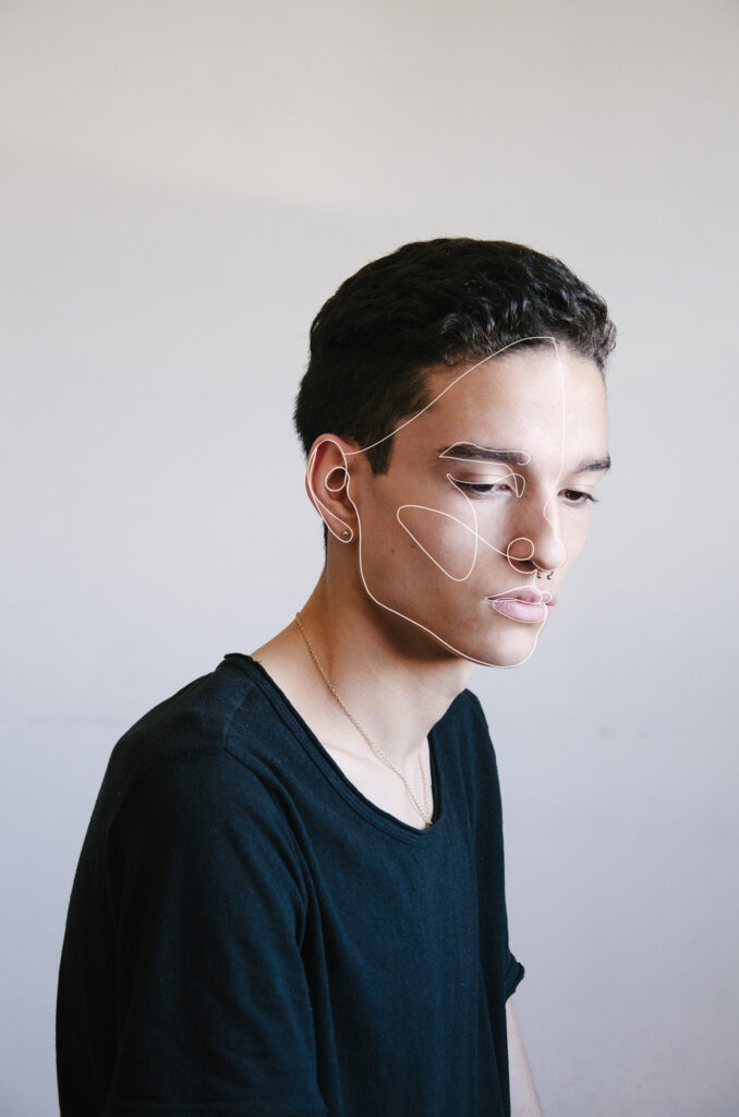 Victor Zepeda's portrait captures a contemplative man with a minimalist wireframe overlay emphasizing the contours of his face.